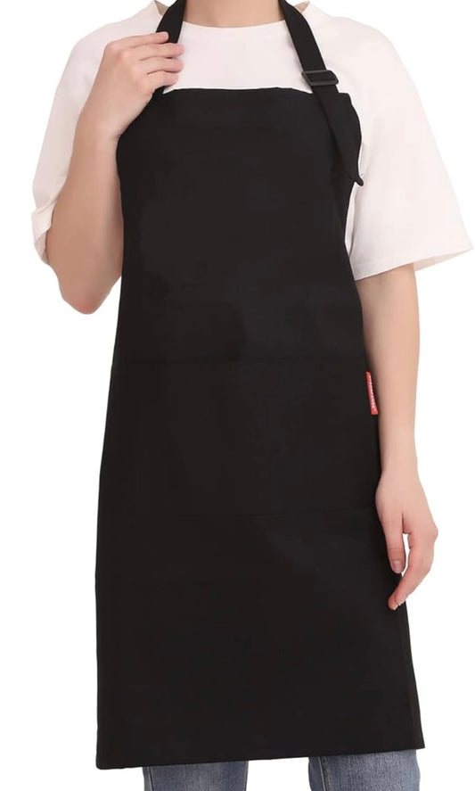 Plain black apron worn over a white T-shirt