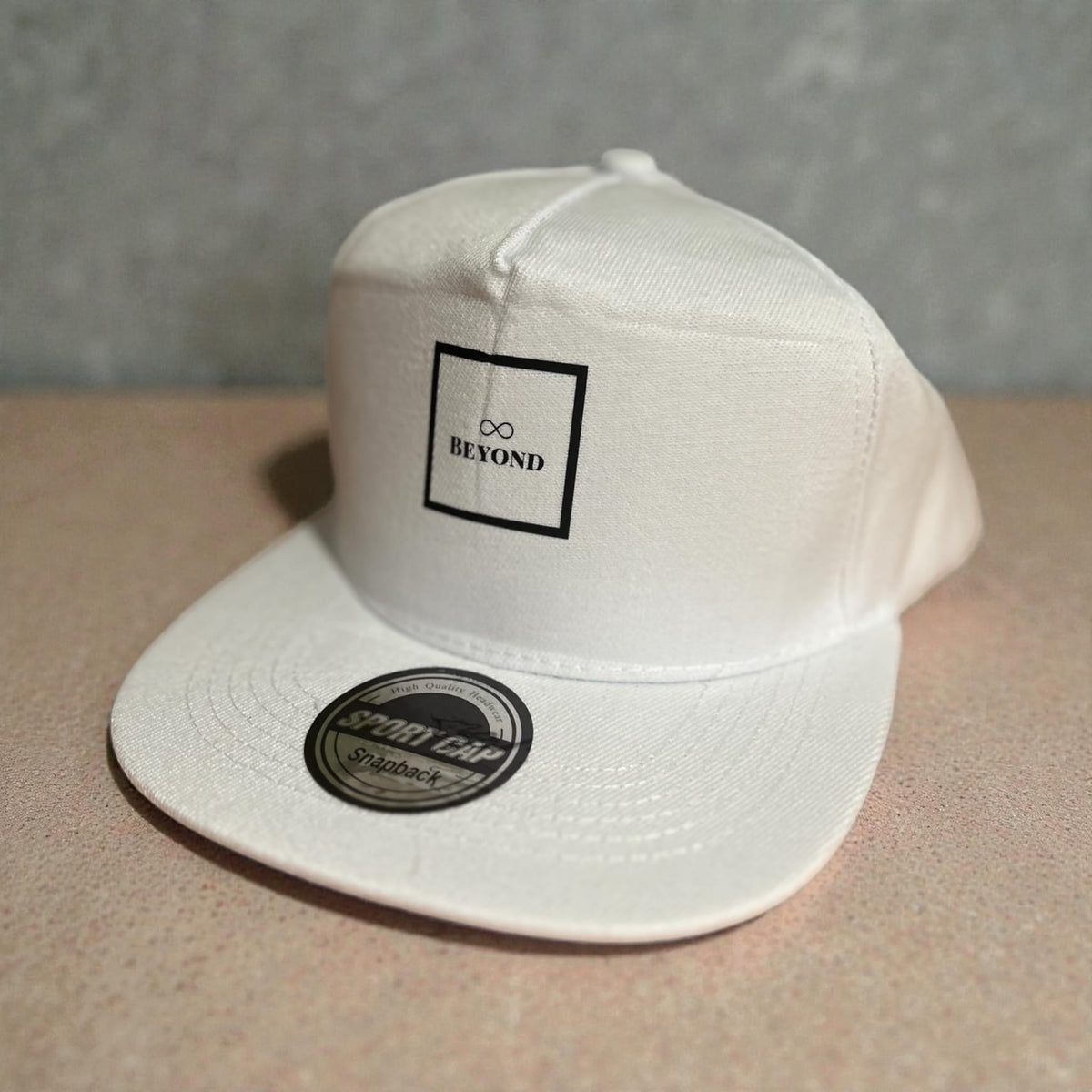 White Beyond snapback cap with square logo